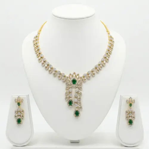 Classic Gold Finish American Diamond Layered Necklace Set with whitw backgroung by The Party Piece brand. best imitation jewelery brand in india