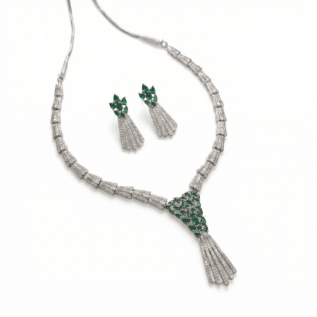Green Crescent Floral Green American Emerald Tassel American Diamond Necklace Set with white background by The Party Piece brand. best imitation jewelery brand in india